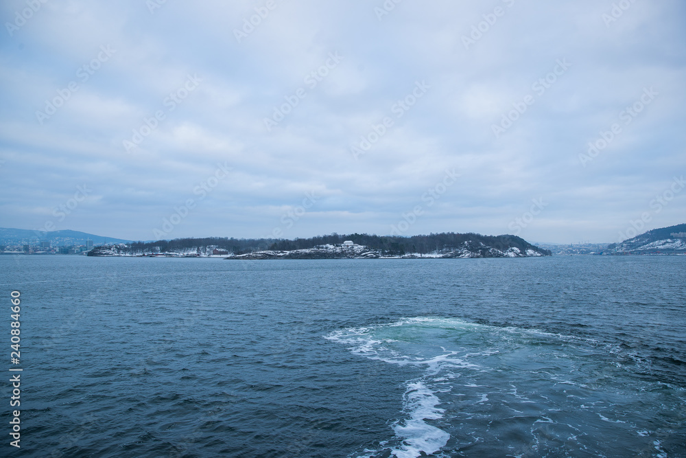 The cruise between the Islands Islands around Oslo Norway during the winter overlooking the sea and the Fjord