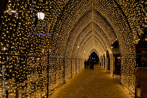Illuminated crossing during Christmas holiday in Oslo Norway during winter all covered with fresh snow during evening time