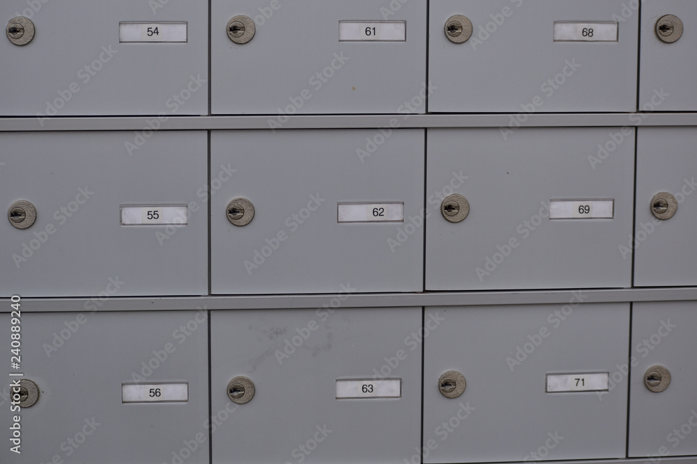 Outdoor brushed aluminum locking mailboxes in a mobile home RV park Outdoor brushed aluminum locking mailboxes in a mobile home RV park