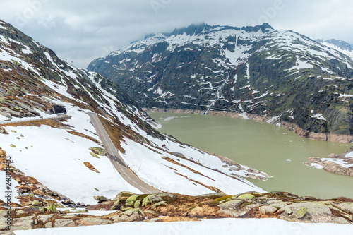 The Grimsel Pass summer landscape with lake (Switzerland). photo