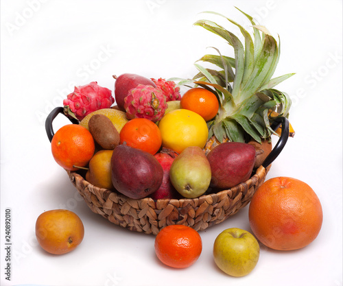 Fototapeta Naklejka Na Ścianę i Meble -  fresh fruits in a wicker basket