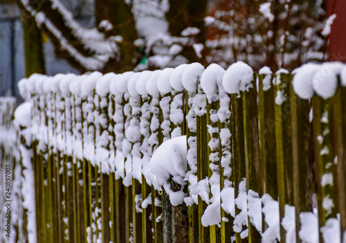 Winter sketches. Fluffy snow on houses  fences and other buildings.