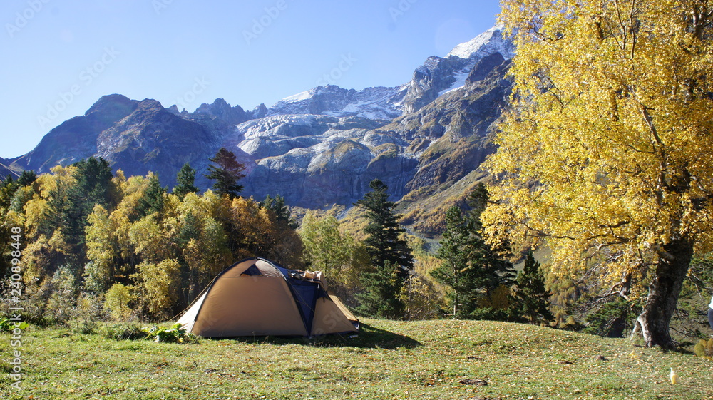 Tent in the mountains on a beautiful meadow