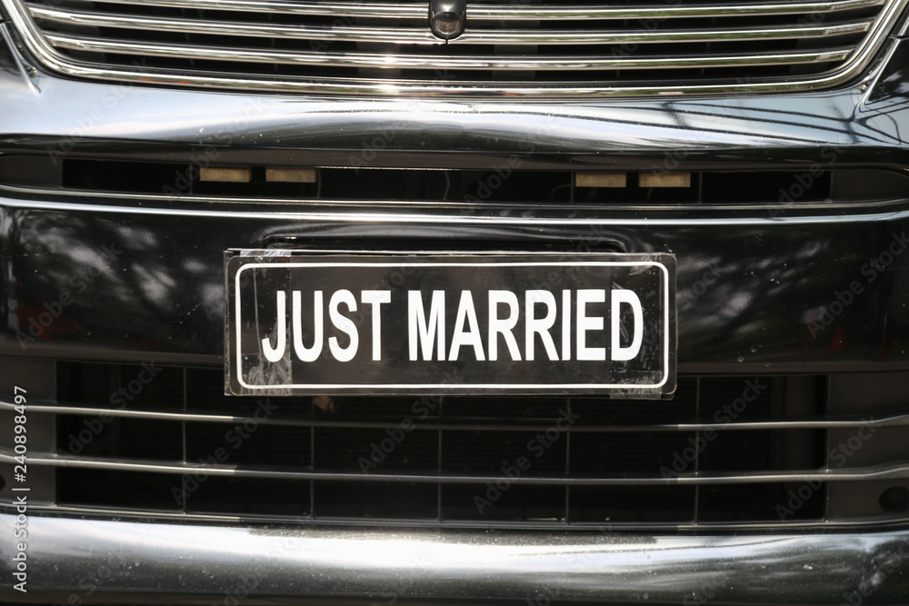 Just married sign in luxury wedding car