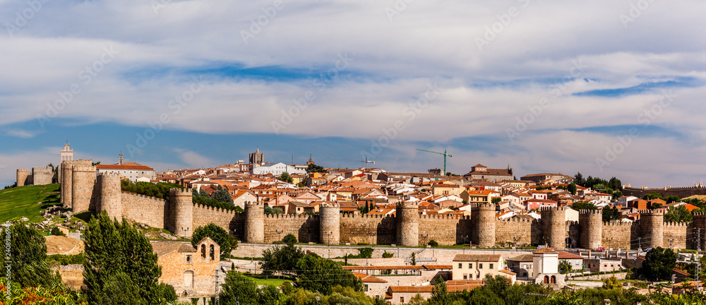 Panorama of Ávila city & Walls of Ávila from the Calvary of Los Cuatro Postes viewpoint. Castilla Leon, Spain.