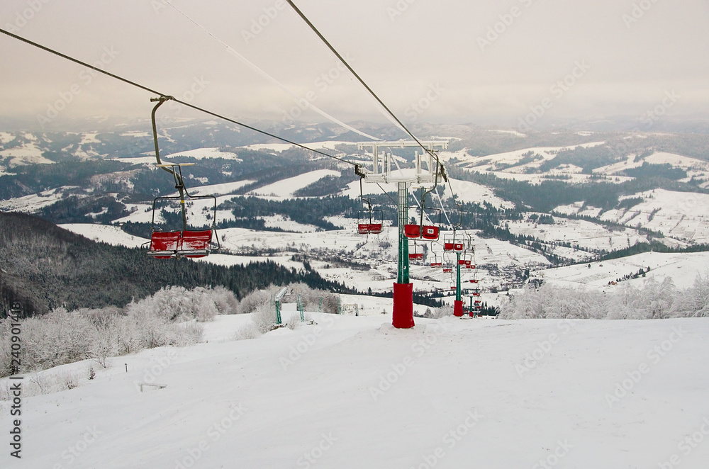 Ski lift ski resort. Winter fun. Family holidays and travel in the mountains. Nature forest landscape Ski lift ski resort. Winter fun. Family holidays and travel in the mountains. Nature forest landscape