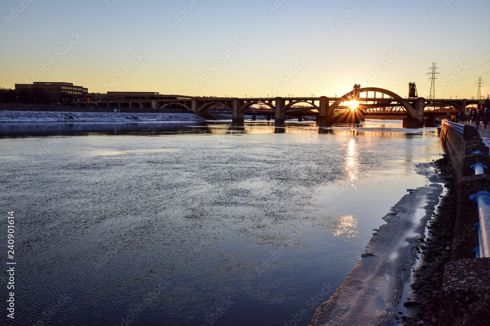 sunset along Minnesota river bridge