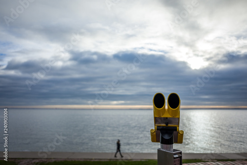 Yellow telescope at the south beach in Wilhelmshaven, Germany. photo