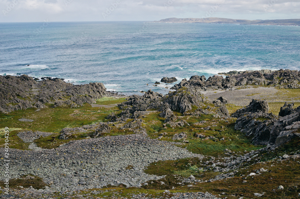 The stone coast of northern Norway and the waves of the Barents Sea The stone coast of northern Norway and the waves of the Barents Sea