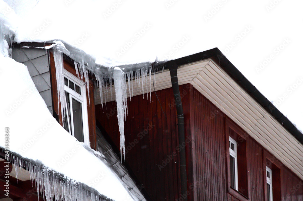 icicles hanging from the roofs of houses danger injury to people