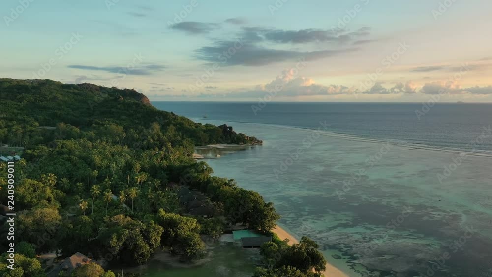 Aerial view of La Digue Island during sunset - beach Anse Union, landscapes of Seychelles islands Aerial view of La Digue Island during sunset - beach Anse Union, landscapes of Seychelles islands