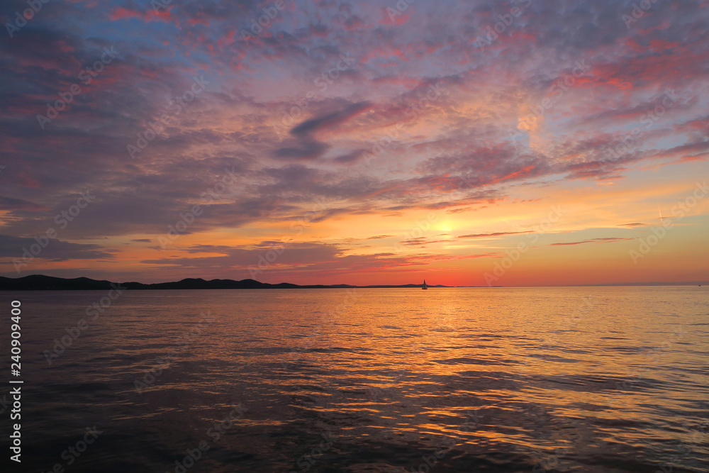Obraz premium amazing meditation sunset on the Adriatic Sea with a sailboat