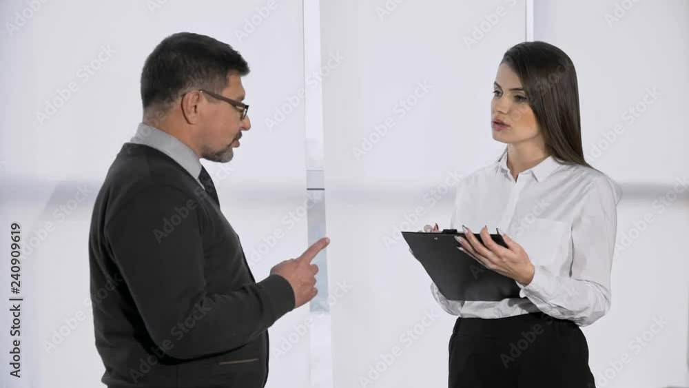The average shooting plan, the big bad boss speaks to the subordinate in the office, the boss swears at the girl clerk, the manager discusses the project with the manager, conversation of the partners The average shooting plan, the big bad boss speaks to the subordinate in the office, the boss swears at the girl clerk, the manager discusses the project with the manager, conversation of the partners