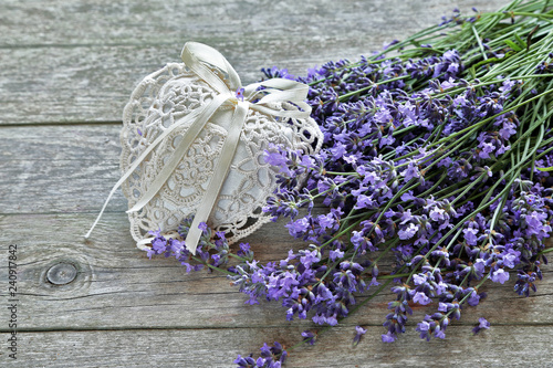 Fototapeta Naklejka Na Ścianę i Meble -  Lavender flowers  with heart 
on wooden background 