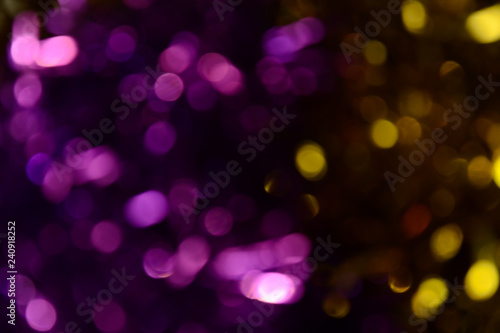 Bokeh. Holiday background. Christmas lights. Glitter. Defocused sparkles. New Year backdrop. Festive wallpaper. Blinks. Carnival. Tinsel. Bokeh retro style photo. © ADELART