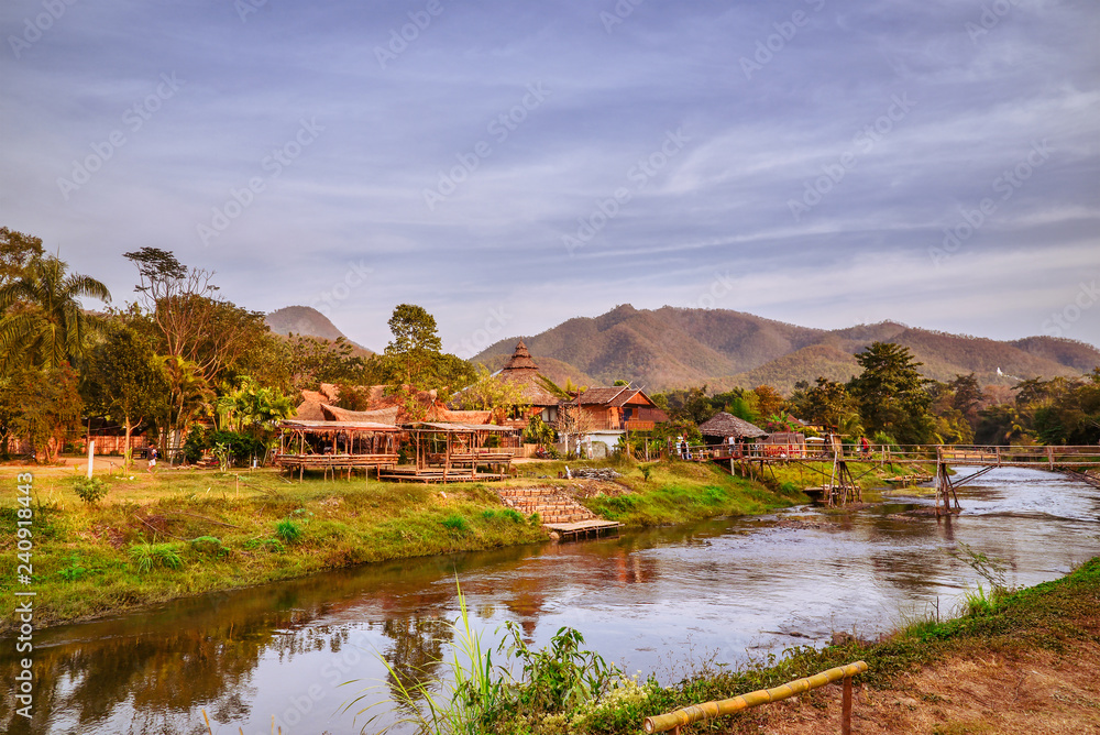 The shore of the river Pai. View of the village and mountains, Northern Thailand