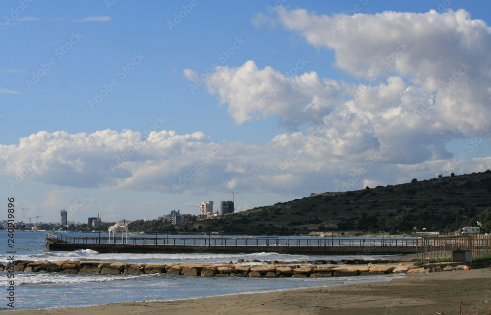 View of two piers, the sky, the Mediterranean sea and the Limassol seafront in December