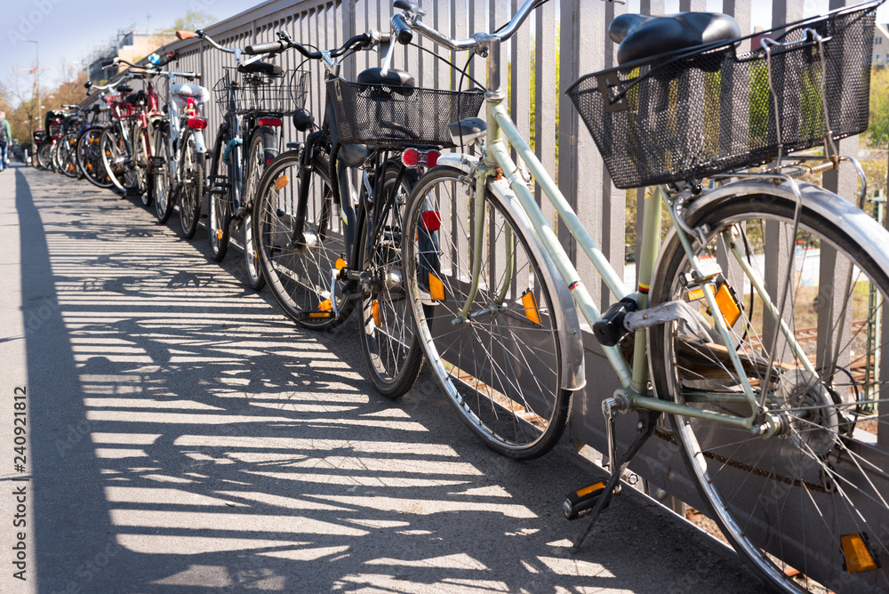Chaotic bicycle/bike parking in a city - transport, public transport - stolen bikes, old bikes, bike theft - copy space. Chaotic bicycle/bike parking in a city - transport, public transport - stolen bikes, old bikes, bike theft - copy space.