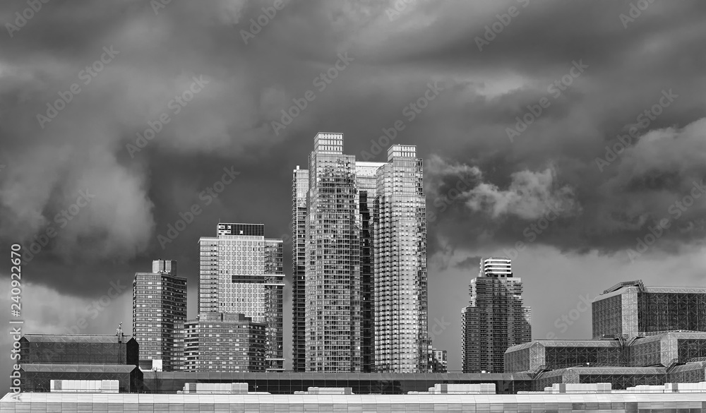 Dramatic sky over modern buildings in downtown New York, USA. Dramatic sky over modern buildings in downtown New York, USA.