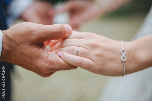 bride and groom holding hands © Dennis