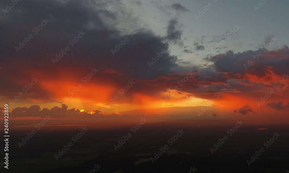 Look down, bright sunset, horizon and red sky. aerial photograph of the drone.