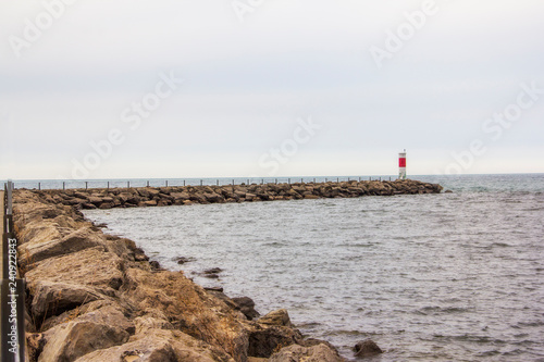 lighthouse at the end of a pier © Benjamin