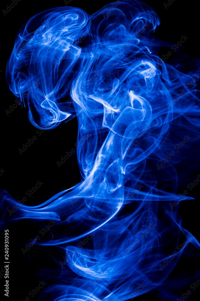 Fototapeta premium Blue smoke on black background