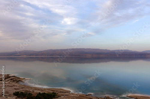 Beautiful sunset in lilac tones over the dead sea. View from Israel coast to Jordan side.
