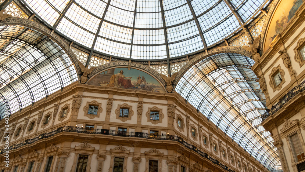 The ceiling of Galleria Vittorio Emanuele from its center, with luxury decorations and the 19th century roof