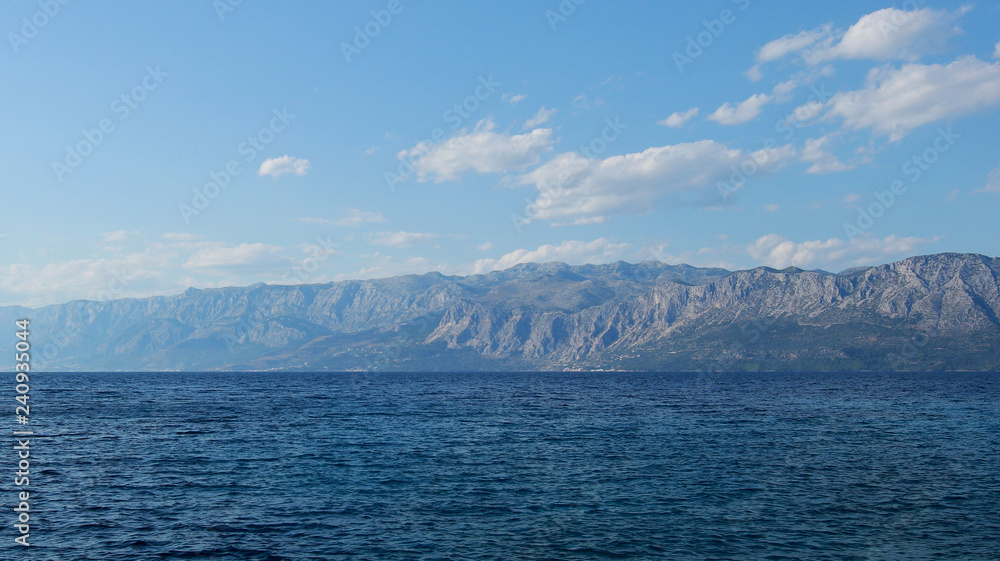 Sea landscape with mountains and clouds in summer in Croatia, only sea and mountain Sea landscape with mountains and clouds in summer in Croatia, only sea and mountain