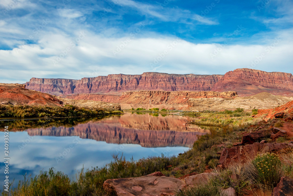 Red rock cliffs reflction on Colorado river near Lees Ferry AZ