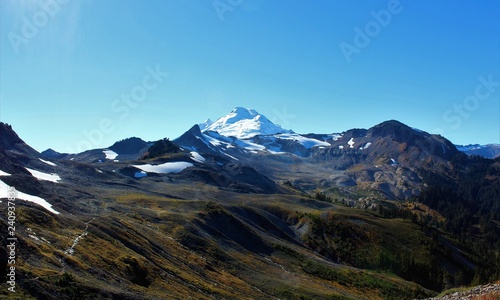 A panoramic view of an active volcano, Mount Baker and Ptarmigan Ridge in the North Cascades