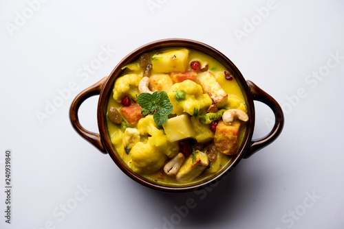 Navratan Korma is a rich, creamy and flavorful Mughlai dish  from India that literally translates to nine-gem curry. The “gems” are the fruits, vegetables and nuts that make up the curry.  photo