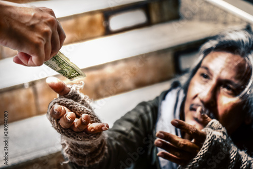 Schilderij op canvas mercy hand give money to hand of poor homeless beggar selective focused