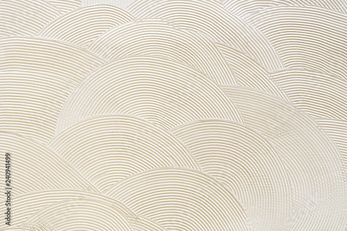 Circular patterns on white plaster. Abstract texture photo