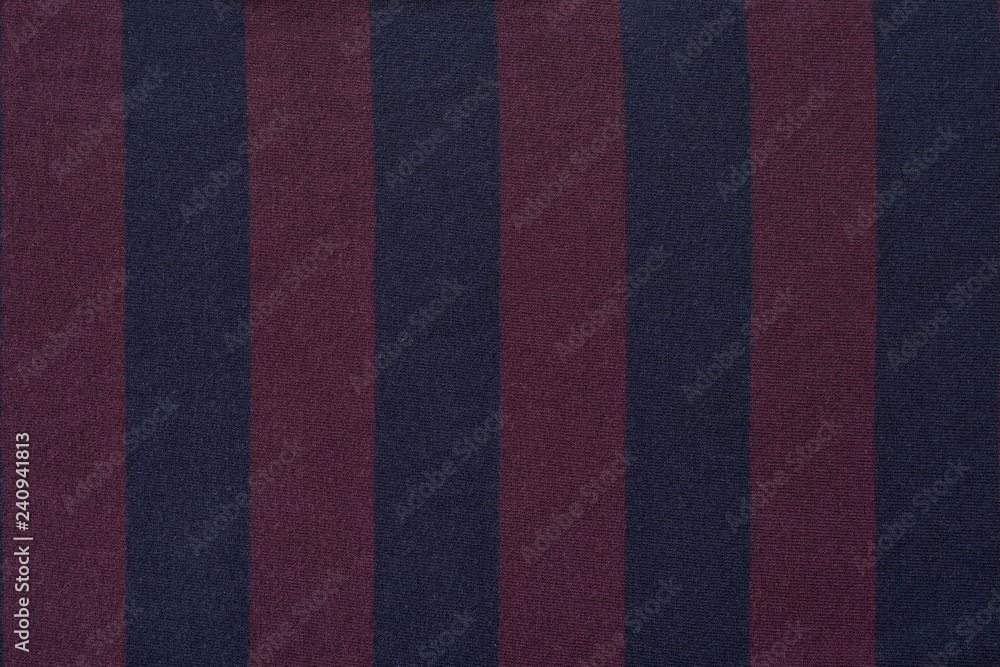 Fototapeta premium Maroon with blue striped fabric. Close-up. Background
