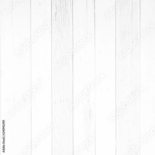 White wood surface with long boards lined up. Light wooden planks on a wall or floor with grain and neutral flat faded tones.