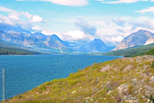 Fototapeta Naklejka Na Ścianę i Meble -  Scenic Looking at a clear blue lake in Glacier National Park.