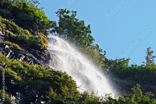 Waterfalls in early morning light in Glacier Narional Park. photo