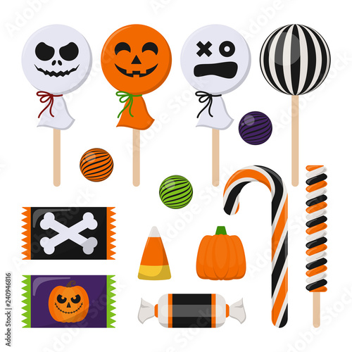 Assortment of Colorful Halloween Candy - Halloween candy including candy cane, lollipop, gum ball, wrapped candy, and more isolated on white background