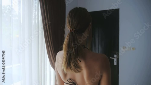 Close up of Young Woman doing sit-ups in the morning at home. The girl does morning exercises