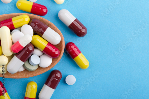 Medicine Pills Tablets And Capsules On Wooden Spoon