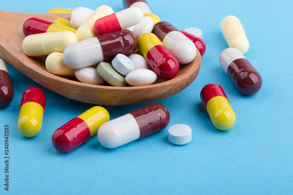 Medicine Pills Tablets And Capsules On Wooden Spoon Medicine Pills Tablets And Capsules On Wooden Spoon
