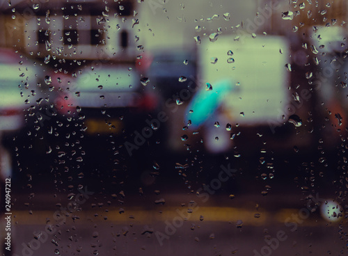 Big background image with rain drops and a girl with a blue umbrella / Girl with a umbrella 