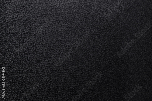 Black leather texture background. Closeup wallet abstract material pattern or luxury bumped animal skin.