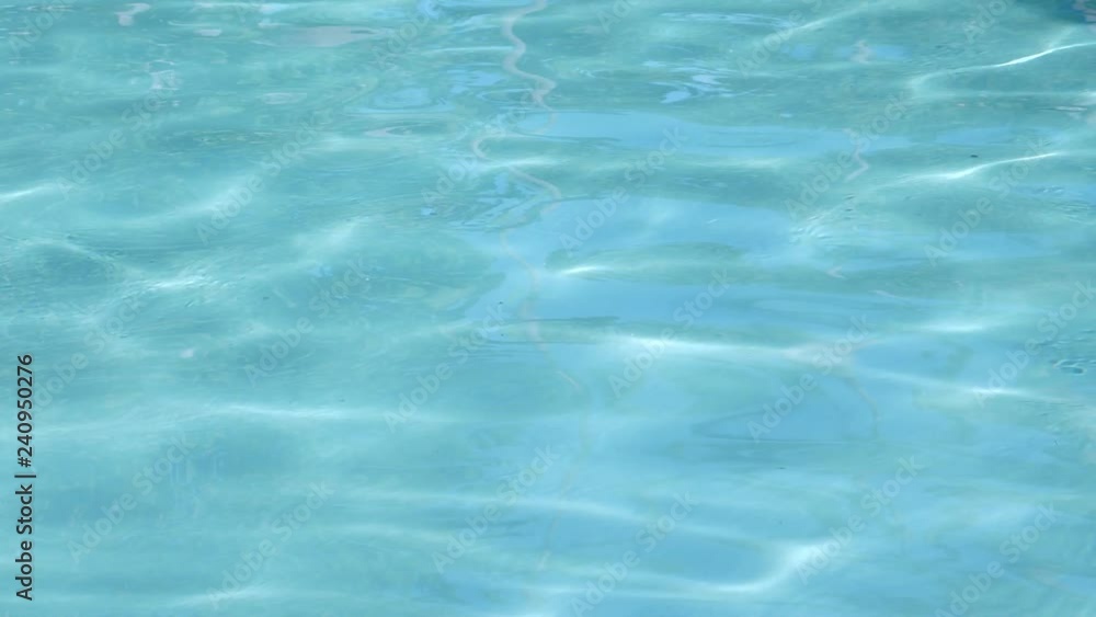 Clean blue water in swimming pool with reflections, nobody Clean blue water in swimming pool with reflections, nobody