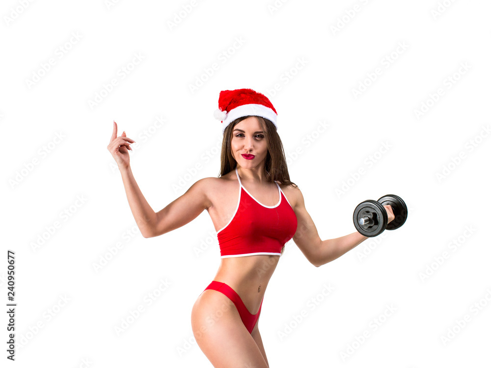Beautiful sporty woman working out in santa hat isolated on white background. Showing on your product Beautiful sporty woman working out in santa hat isolated on white background. Showing on your product