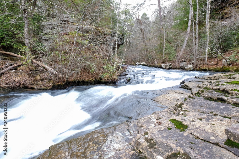 Long exposure of the gushing whitewater of the Little Gizzard Creek by the Fiery Gizzard Trail near Foster Falls, South Cumberland State Park on the Cumberland Plateau. Long exposure of the gushing whitewater of the Little Gizzard Creek by the Fiery Gizzard Trail near Foster Falls, South Cumberland State Park on the Cumberland Plateau.