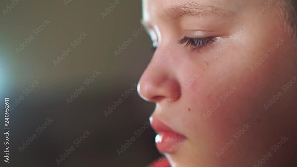 Face close-up boy teenager uses a 3D pen. He creates a plastic 3D figure. Face close-up boy teenager uses a 3D pen. He creates a plastic 3D figure.