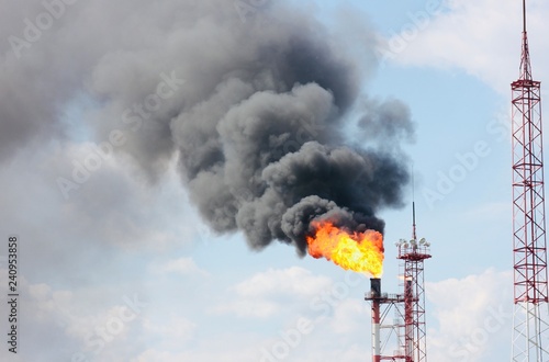 Combustion of associated petroleum gas in oil production areas. Environmental pollution.  Environmental problem. Acrid, thick smoke and flames. Gas flaring. 